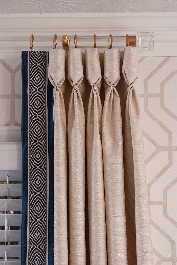 Beautiful goblet pleat drapery panels with added decorative tape.